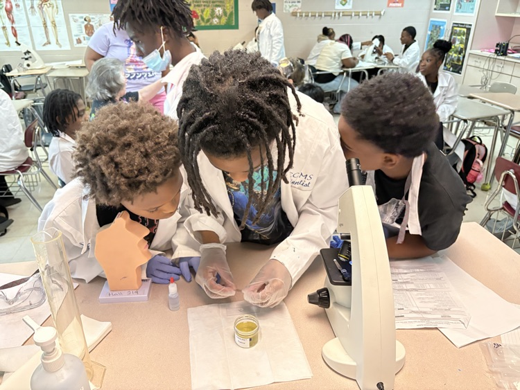students wearing white labcoats
