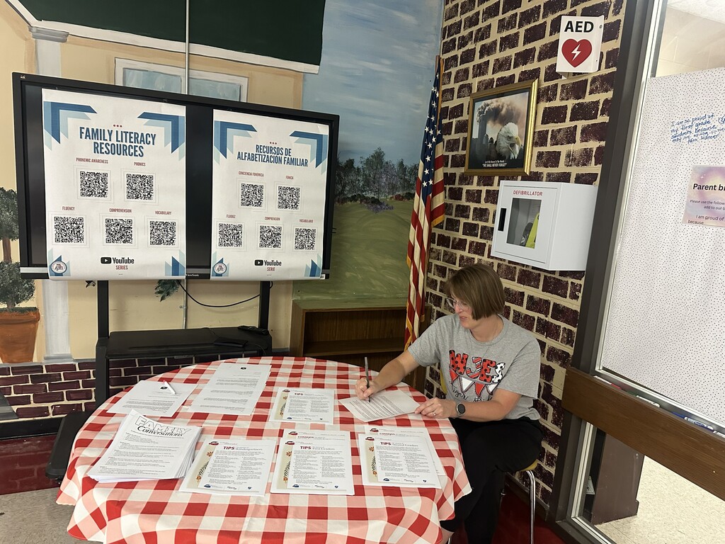 lady sitting at informational table