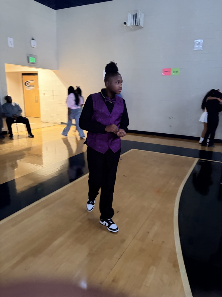 Person wearing purple suit