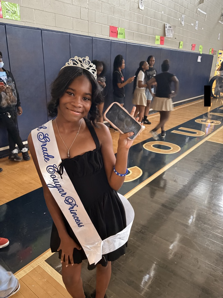 Girl wearing dress sash and crown