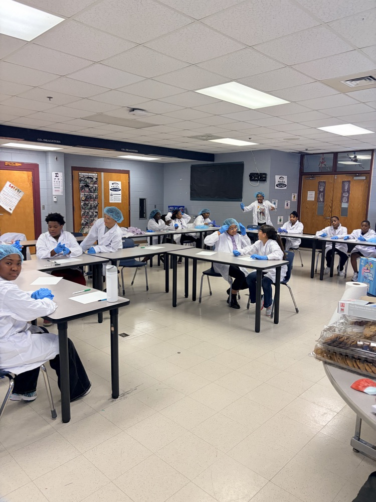 kids sitting in lab coats