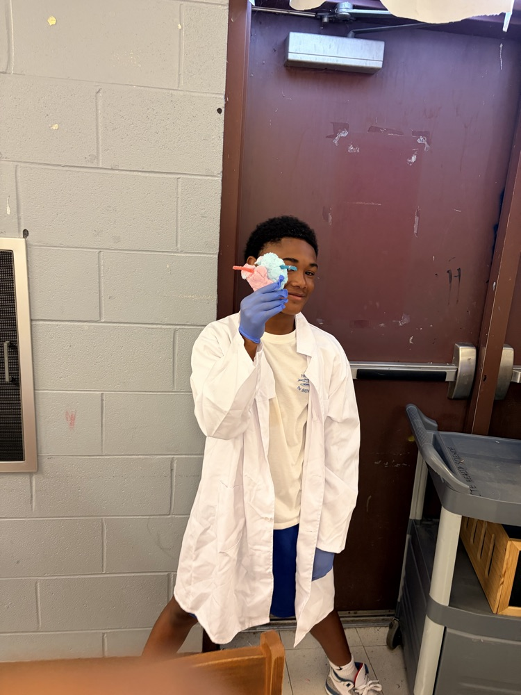 Boy in lab coat with heart
