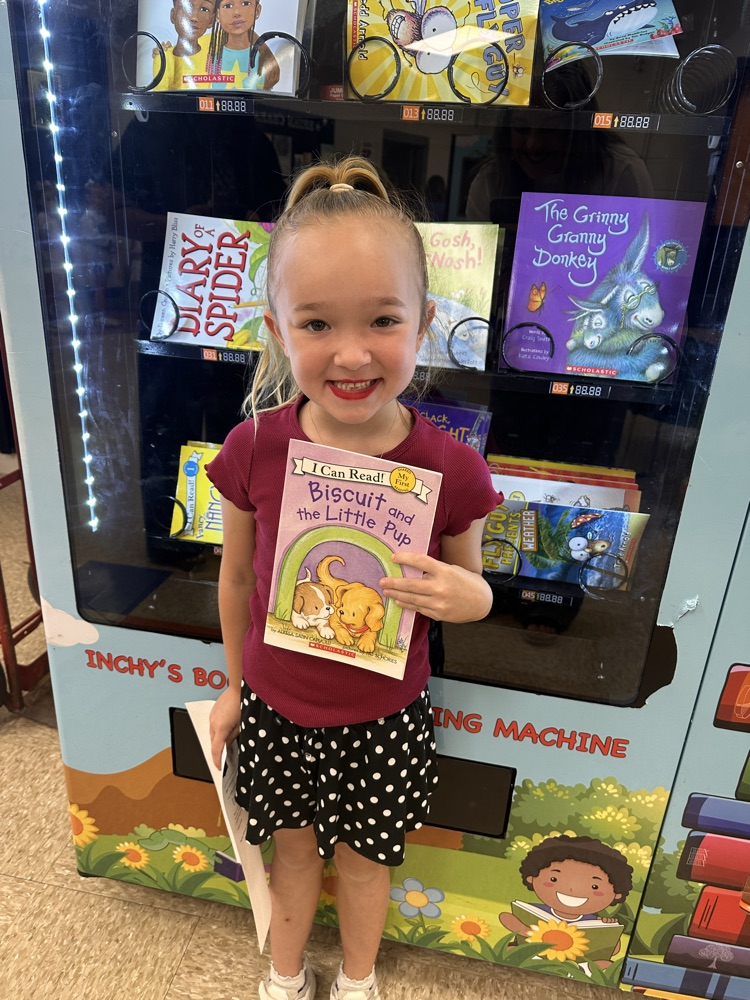 smiling girl holding a book