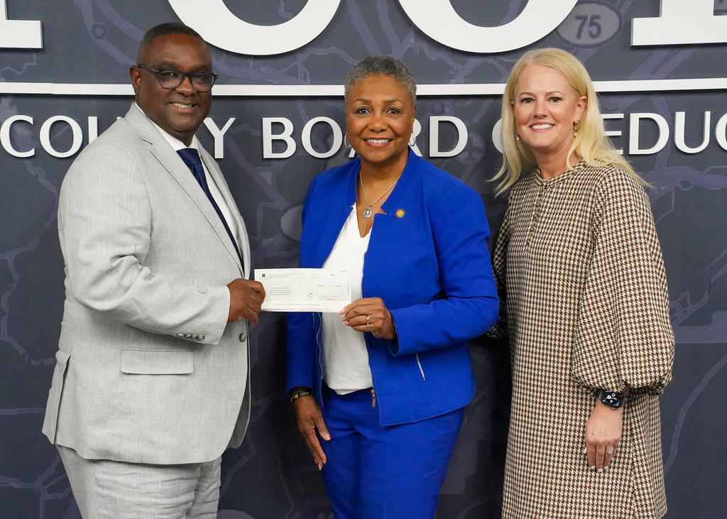 Dr. Walter Gonsoulin and Dr. Laura Ware receive a $4,000 check from Senator Linda Coleman-Madison to support Career Tech programs.
