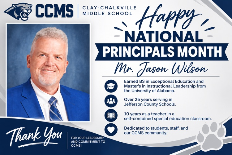 Man in a navy blue suit. white background describes Happy National Principal Month Mr. Jason Wilson