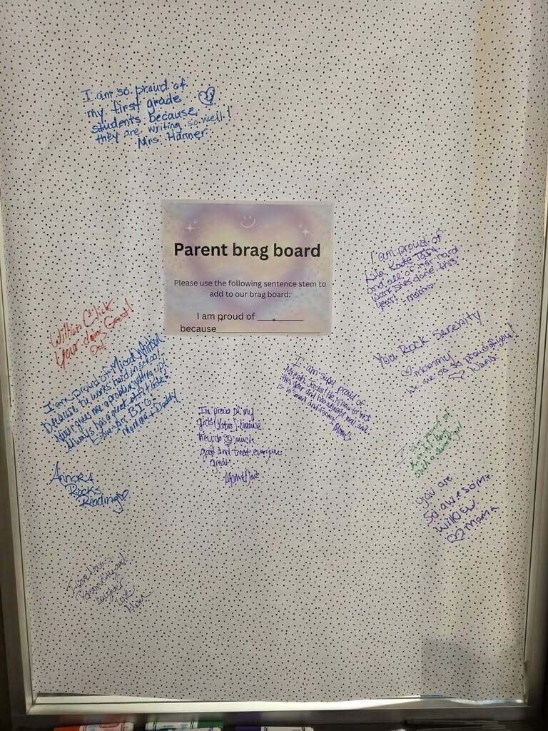 Handwritten notes left by parents are on a board set up in a school.