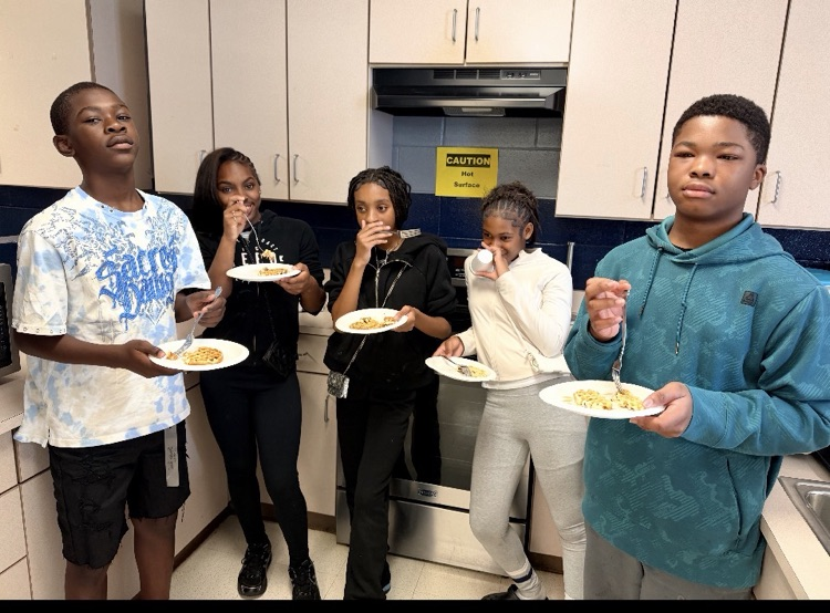 students eating waffles in kitchen