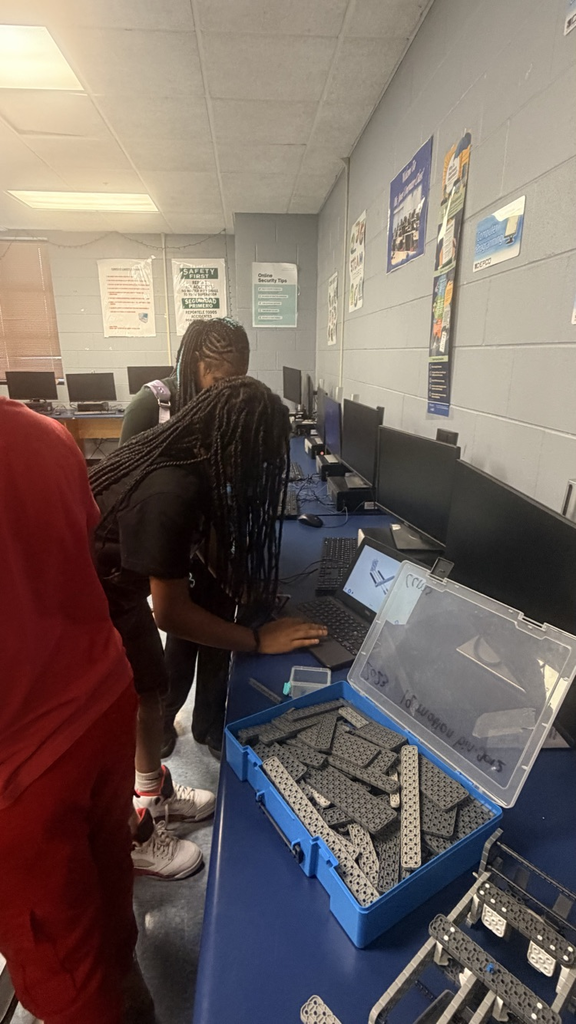 students working on robots