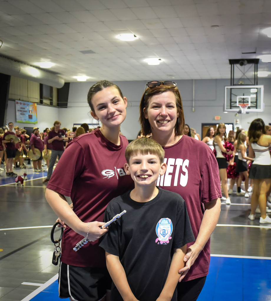 Family posing together at pep rally