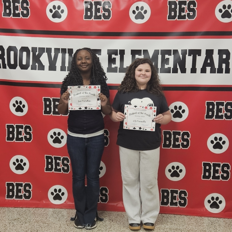 Zoie McCallum and Lily Maravilla show off their Student of the Month Certificates!