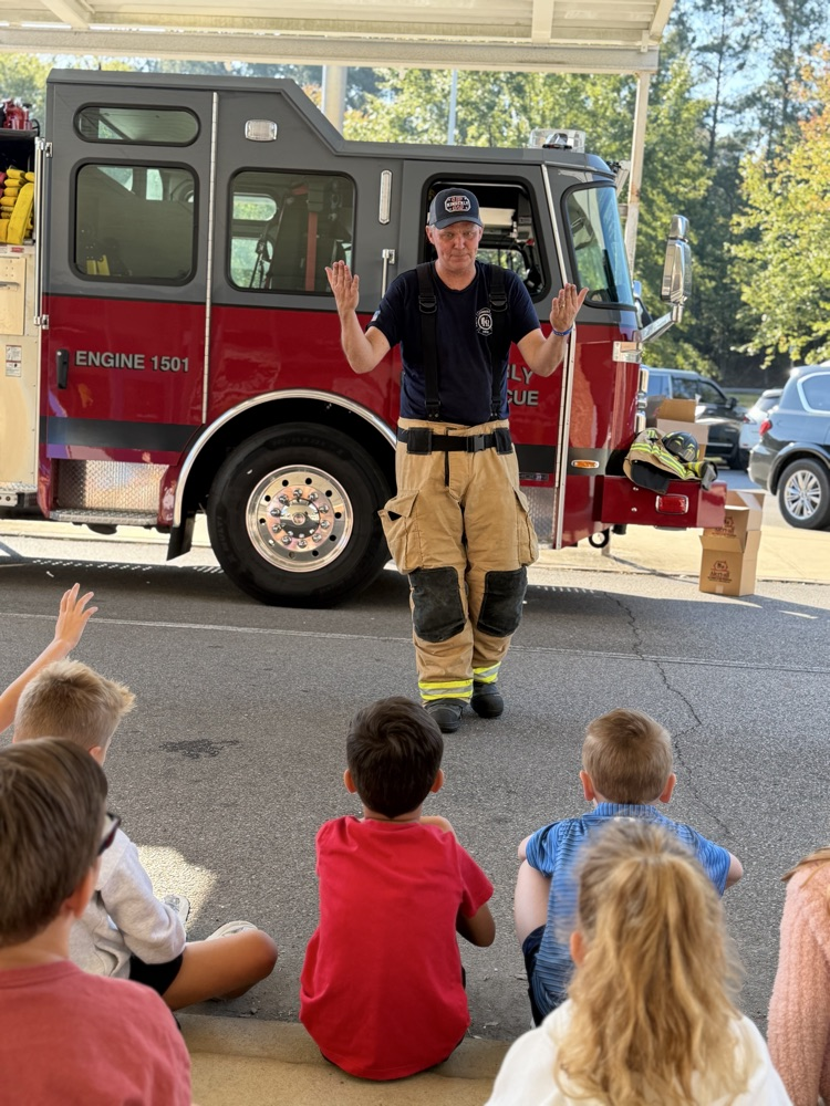 a fireman speaking to students 