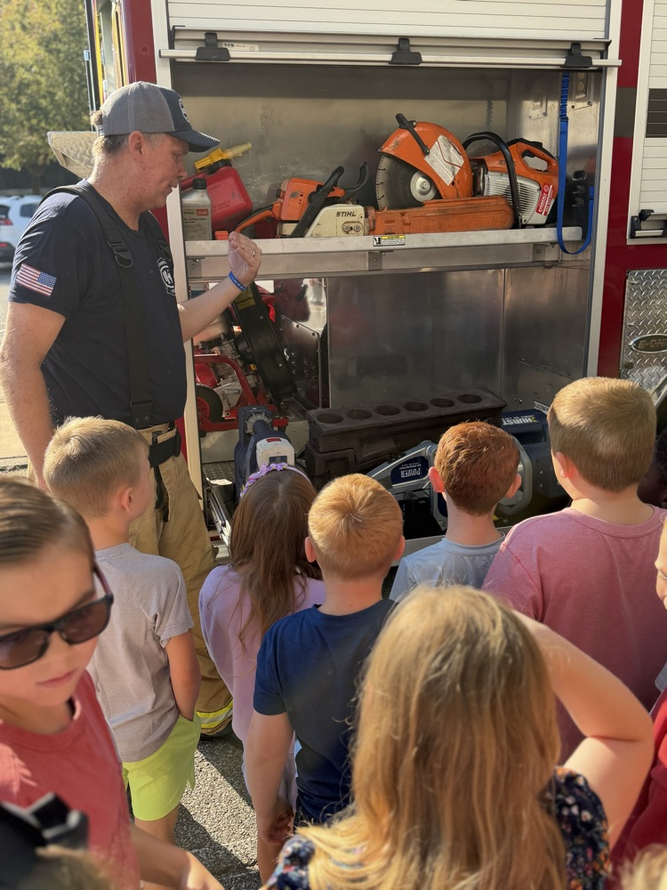 students looking at the fire truck