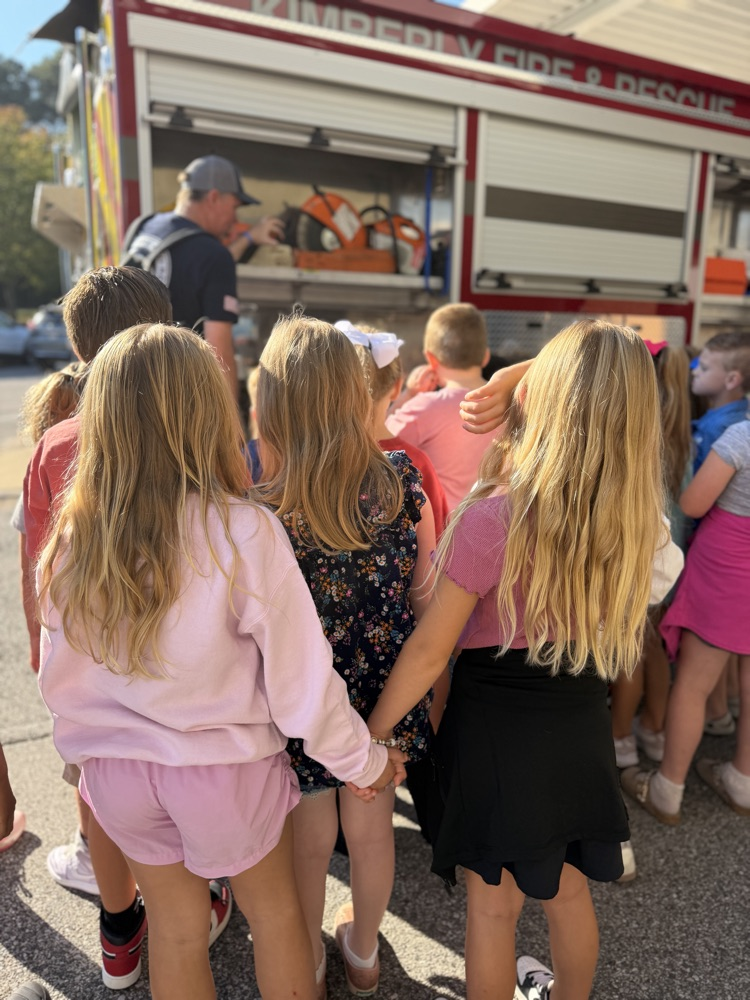 students looking at the fire truck 