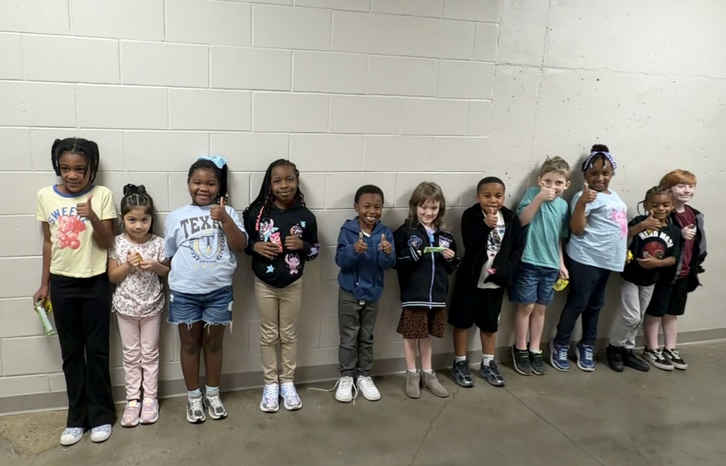 Group photo of McCalla Elementary first-grade students being recognized for meeting their mCLASS and i-Ready benchmark goals.