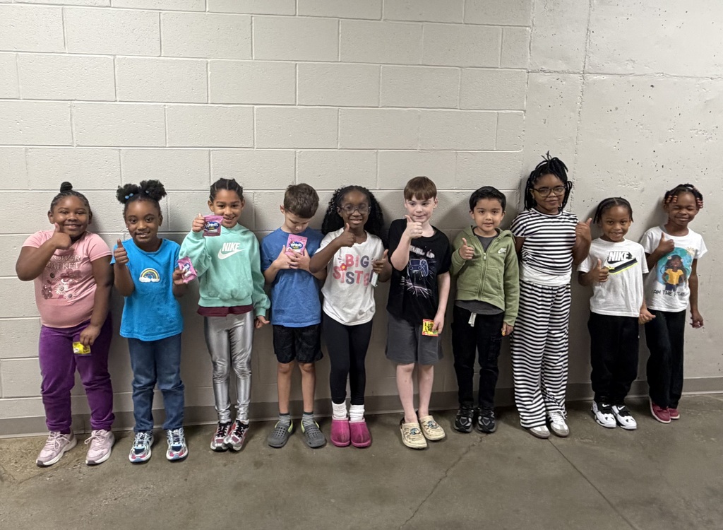 Group photo of McCalla Elementary first-grade students being recognized for meeting their mCLASS and i-Ready benchmark goals.
