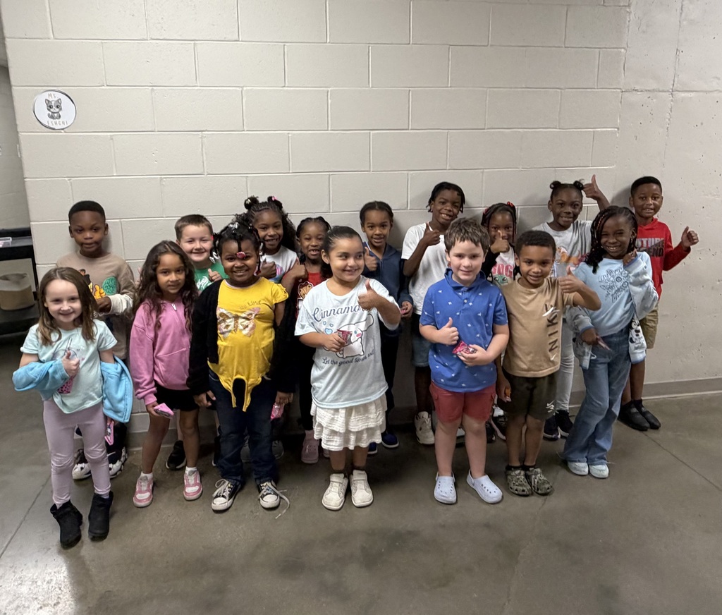 Group photo of McCalla Elementary first-grade students being recognized for meeting their mCLASS and i-Ready benchmark goals.