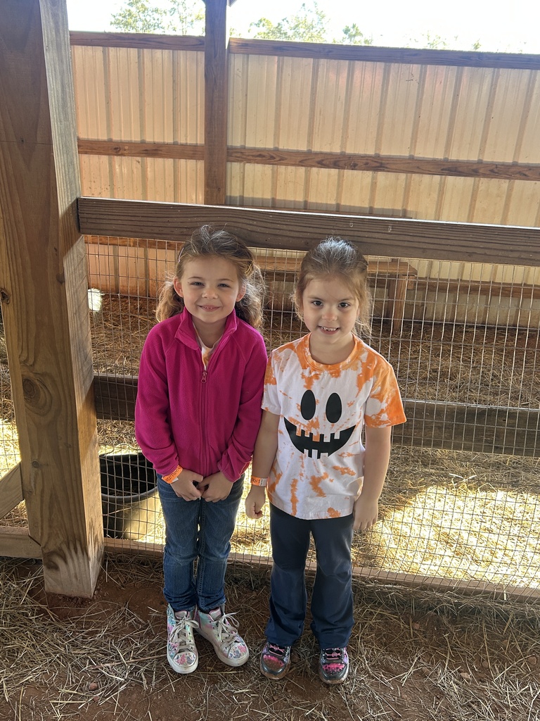 two kids at the farm for a field trip