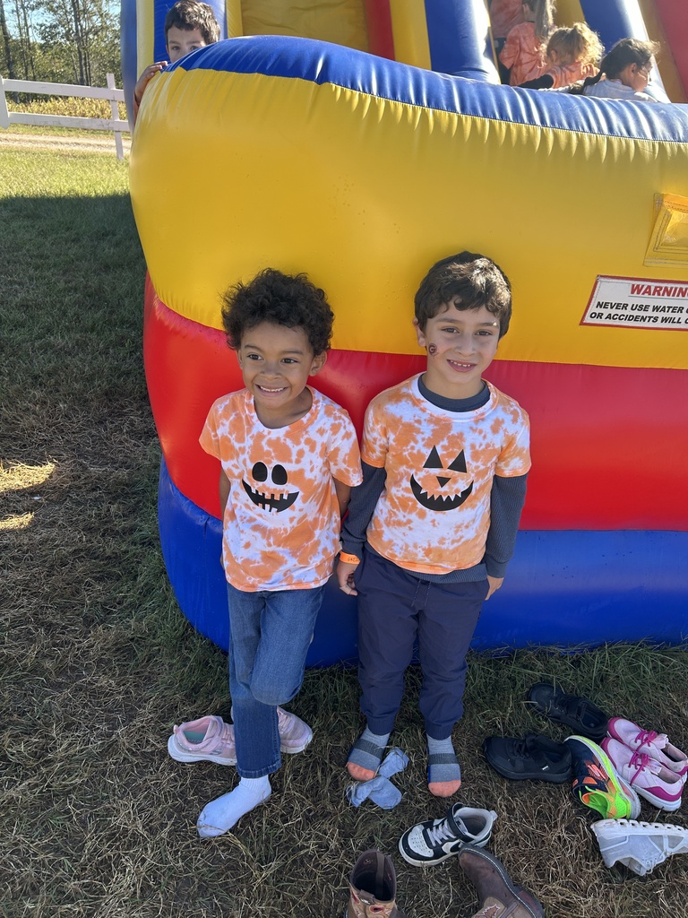 two students at pumpkin patch