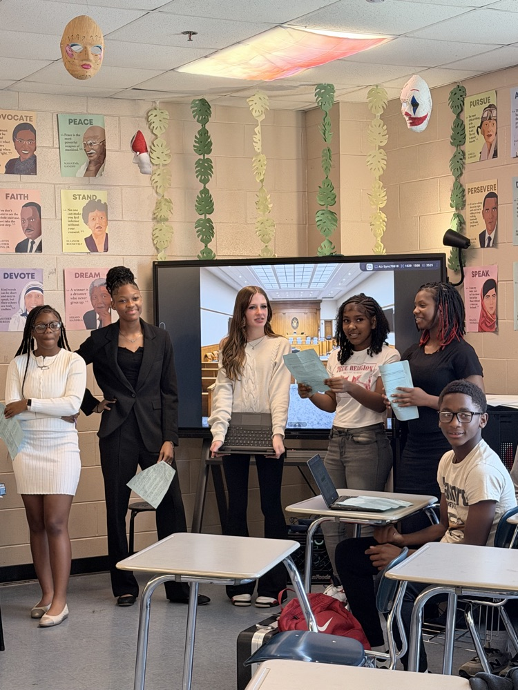 Students presenting in professional clothes