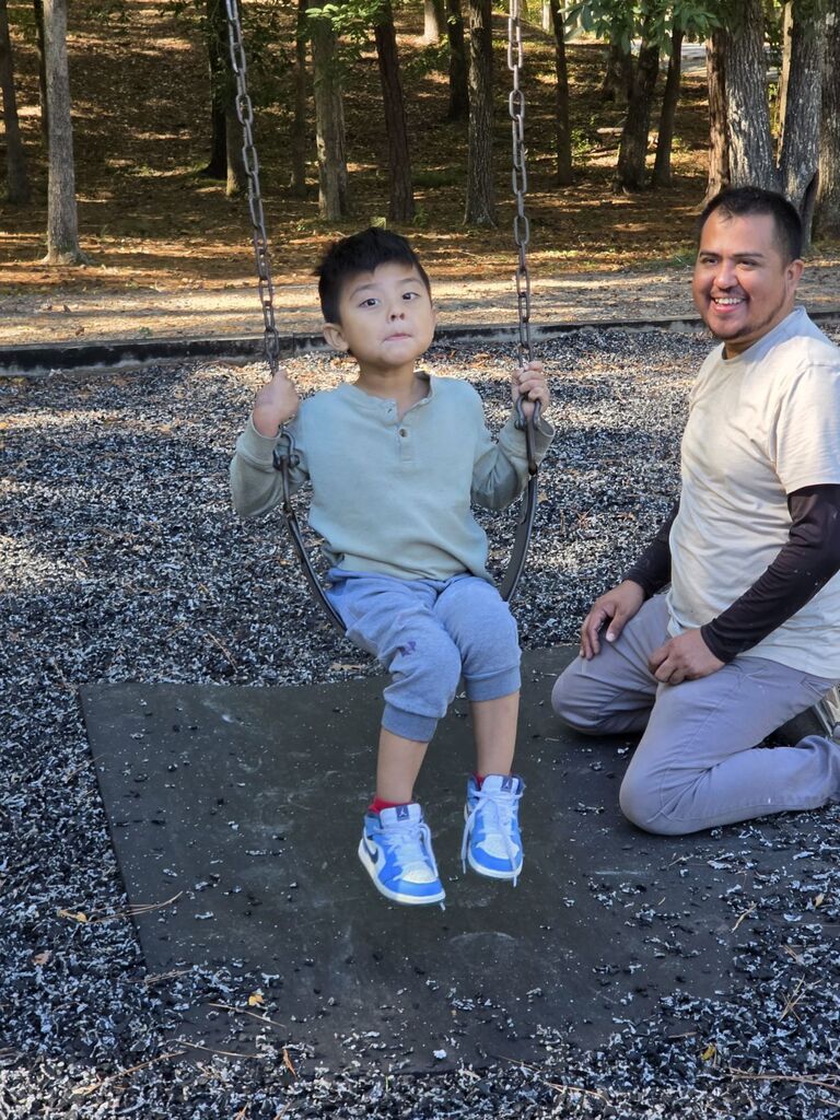 a student sitting on a swing