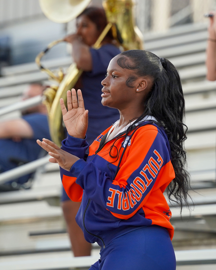 A Fultondale auxiliary member performs a routine during a football game.