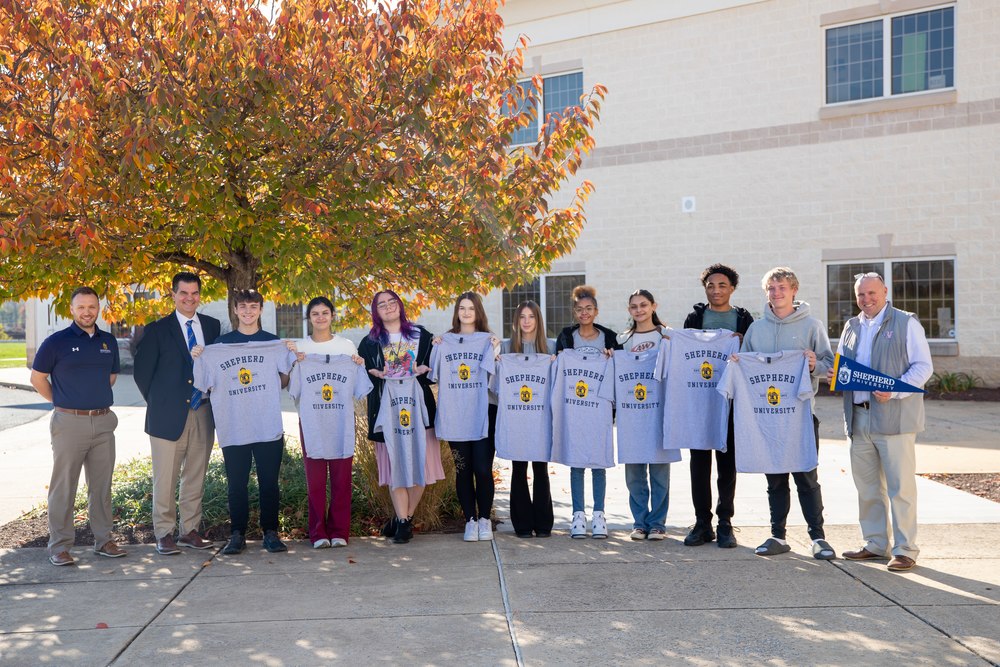 9 WHS Seniors with Shepherd Swag after being announced as firs 9 direct admit students.