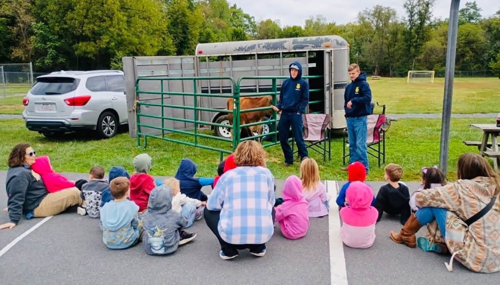 SJES students listening to WHS students talk about their farm animals