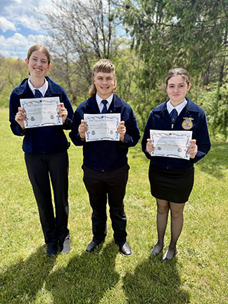 3 students holding certificates
