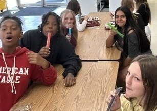 Students eating popsicles