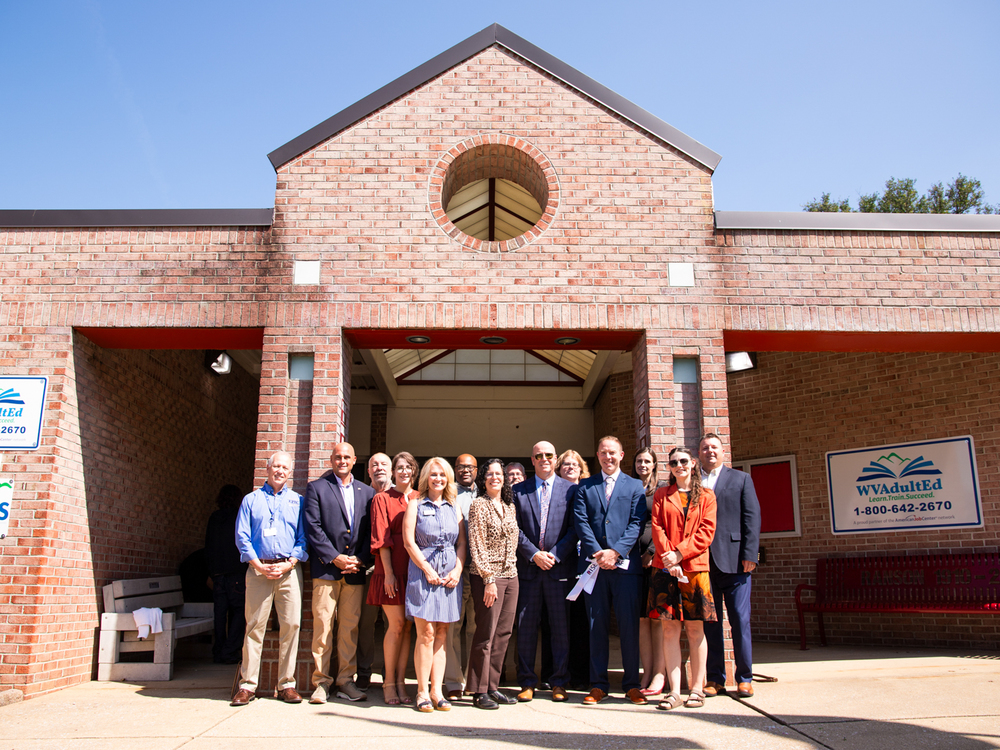 Suoerintendent Bishop and members of the Jefferson County community standing in front of the new RISE facility