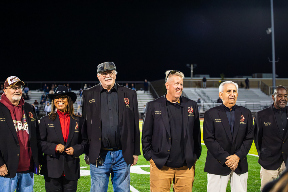 JHS 2025 HOF inductees standing on the football field