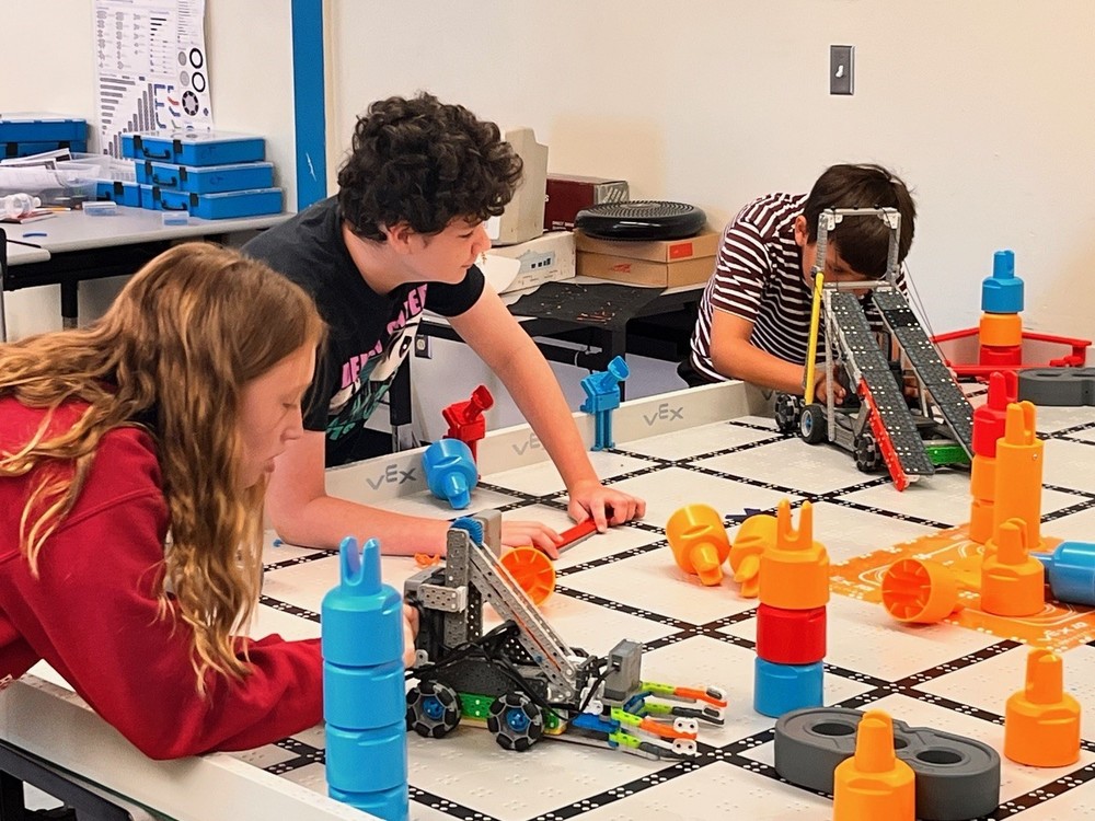 Campers test their robot design on the “Mix and Match” playing field during day three of the Jefferson County Schools robotics camp held July 14-17, 2025