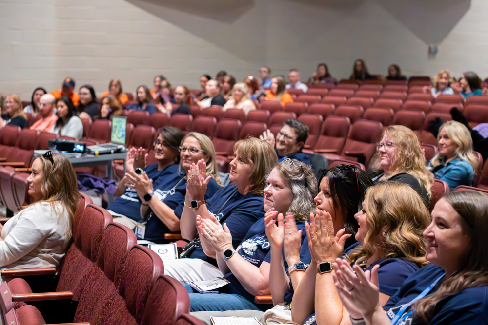 Members of the JCS Special Education staff applauding at the annual convocation