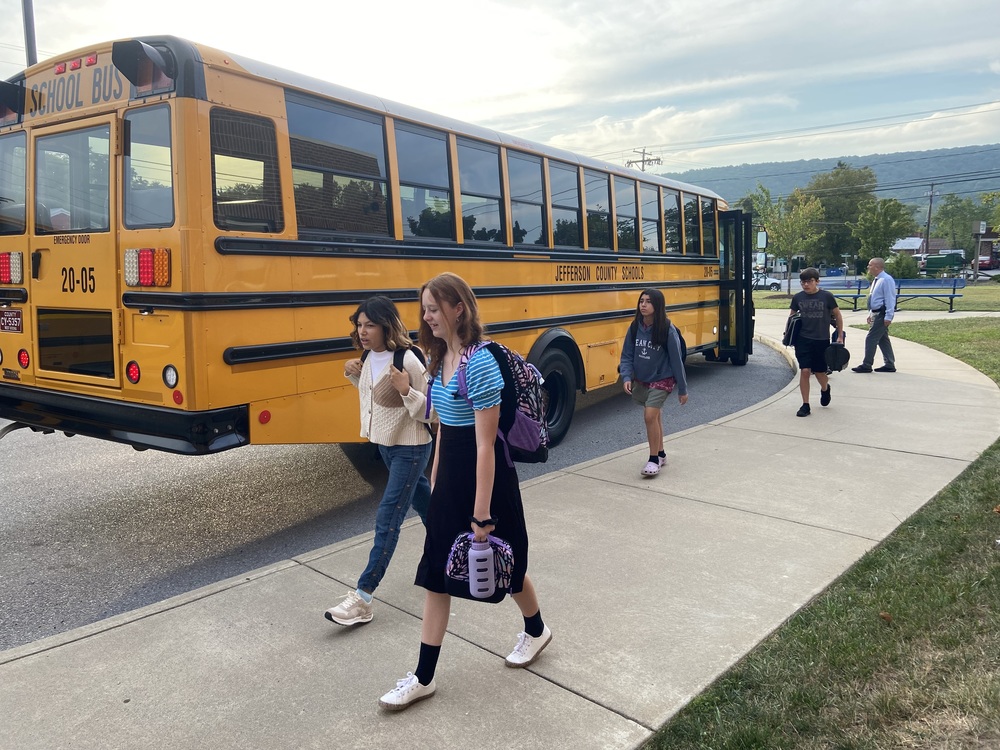 JCS students getting off a school bus on the first day of school