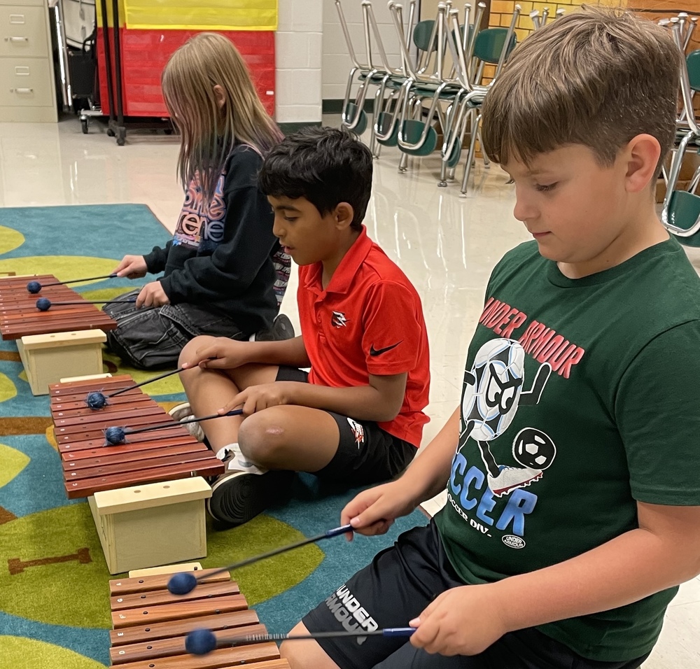 Students playing xylophone