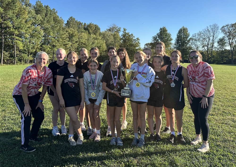 Girls Cross Country Team with county first place trophy