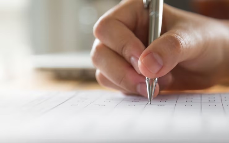 Person using pencil to take a test
