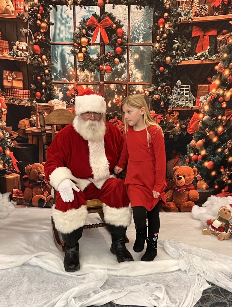 Santa visits with little girl