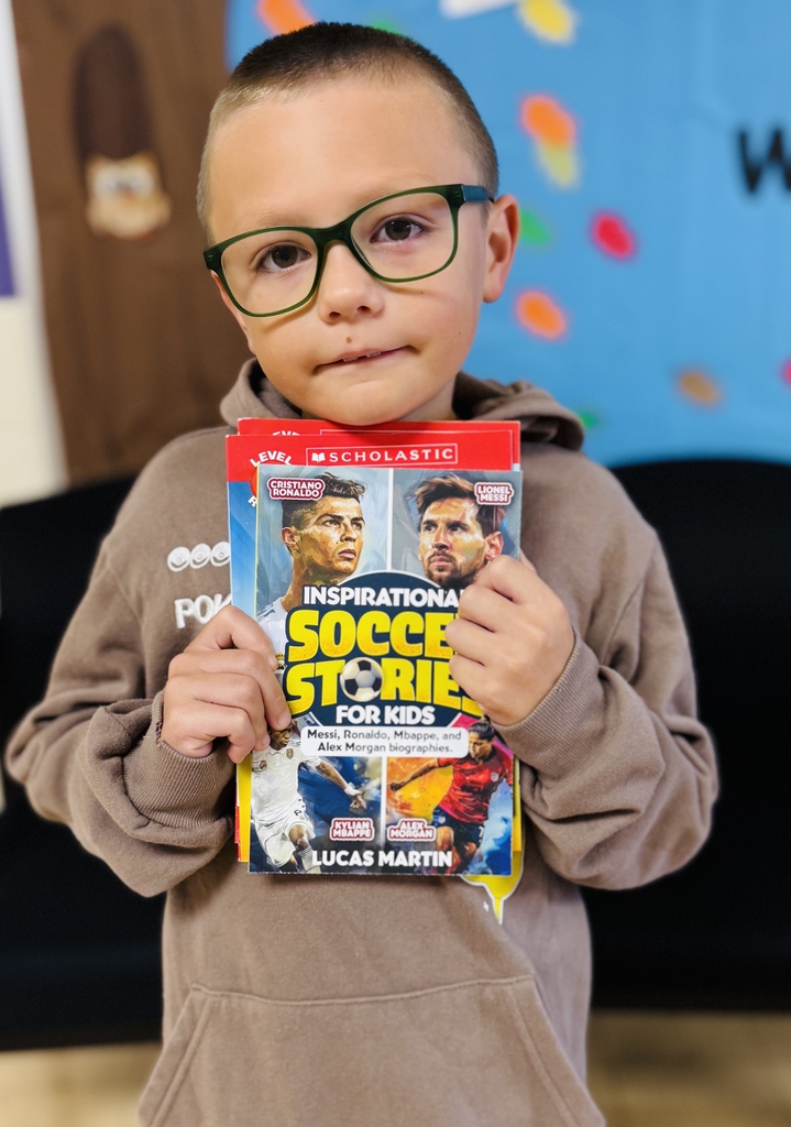 Bayne holding his books