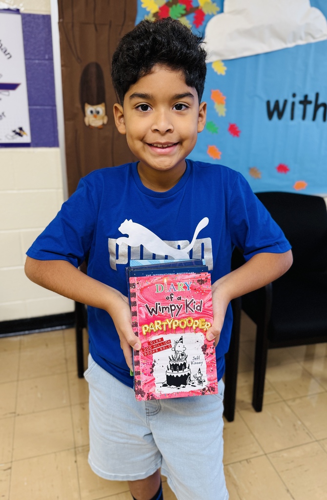 Gianluca holding his books