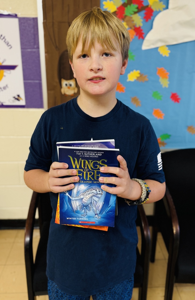 Joseph holding his books