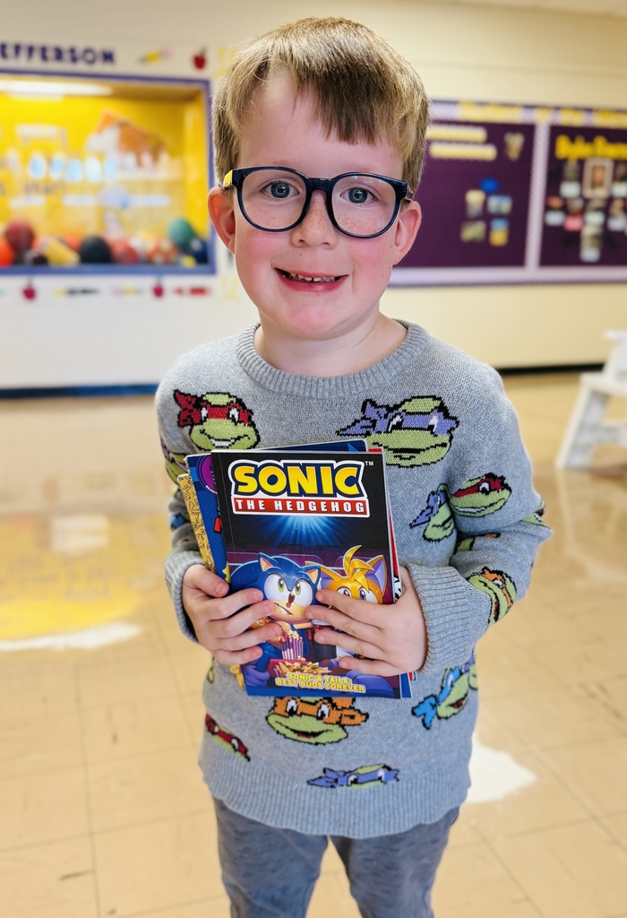 Quincy holding his books