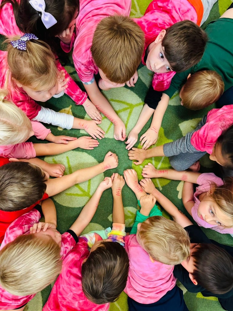 Students showing the tallies on their arms