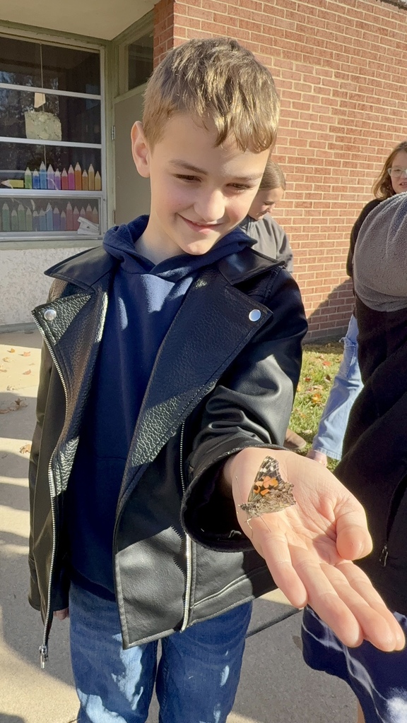 student holding butterfly
