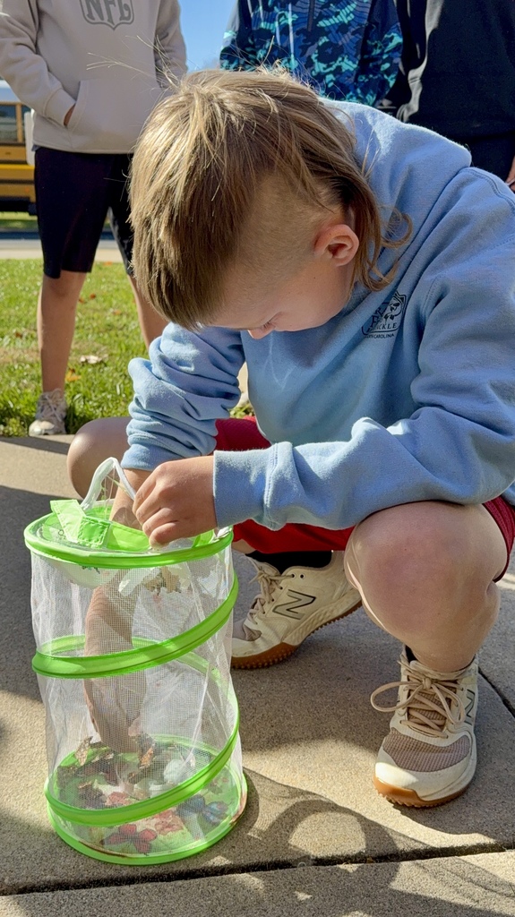 student holding butterfly