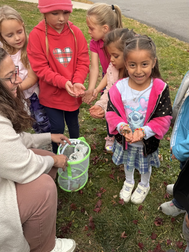 student holding butterfly