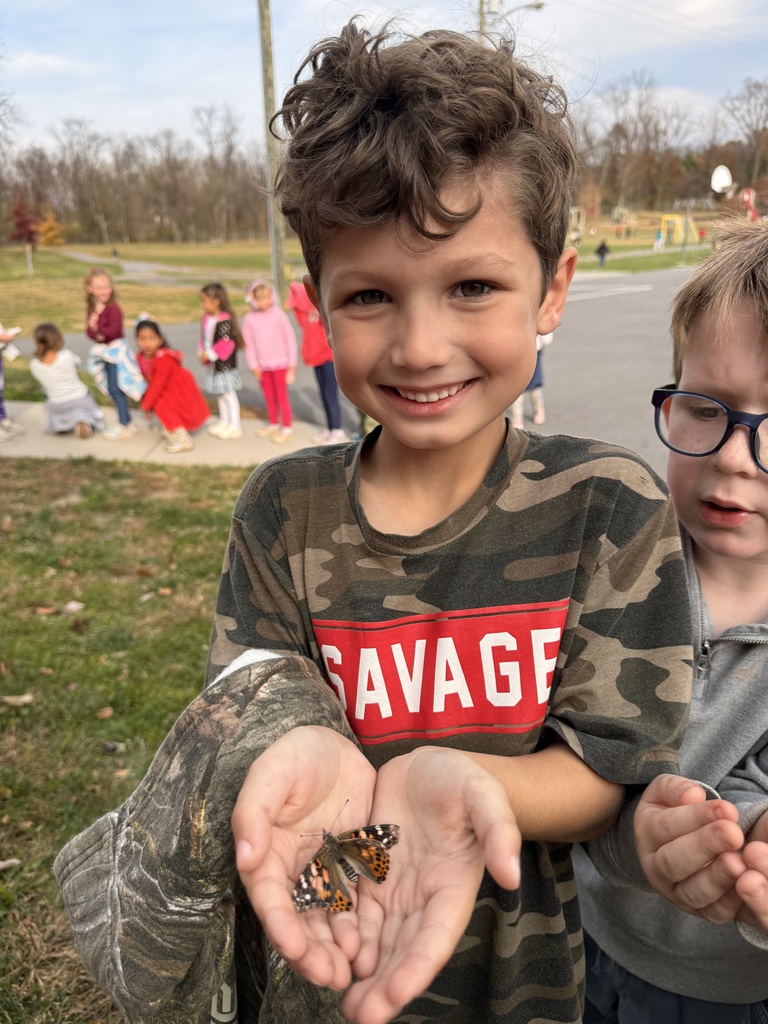 student holding butterfly