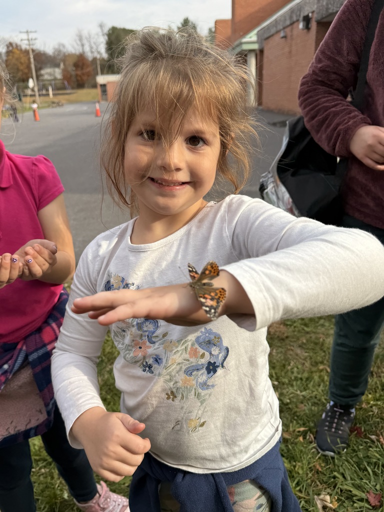 student holding butterfly