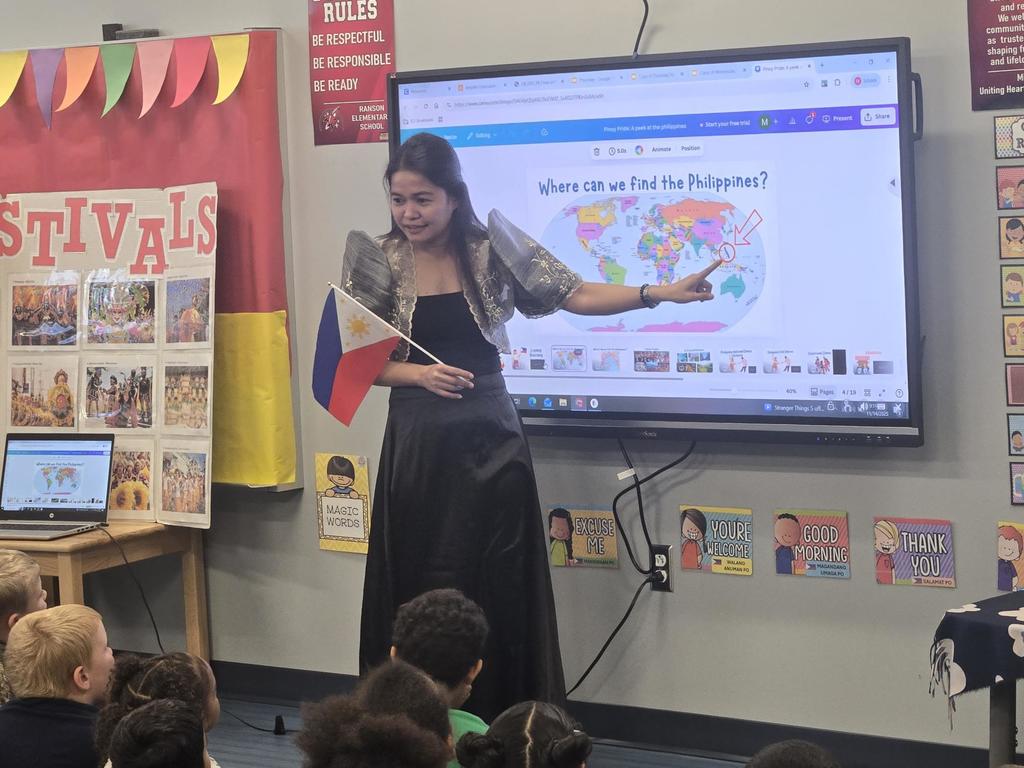 Ms. Ribot showing the Philippines on a world map