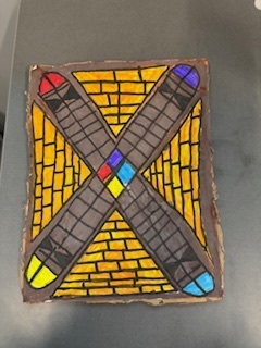 A diorama of an ancient temple with drawn bricks